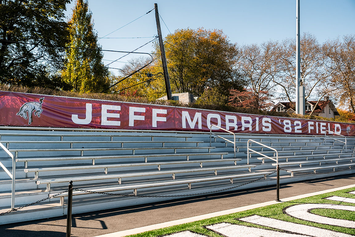 Bleachers with a banner that says Jeff Morris '82 Field